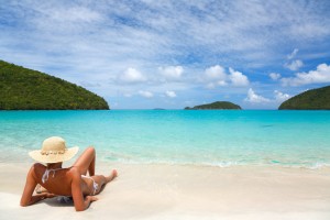 woman relaxing on a tropical beach in the Caribbean
